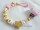 Schnullerkette mit Namen "Sterne"  in rosa-gold